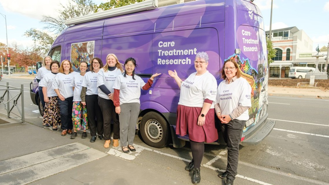 Clinical Trials Bus Group Shot
